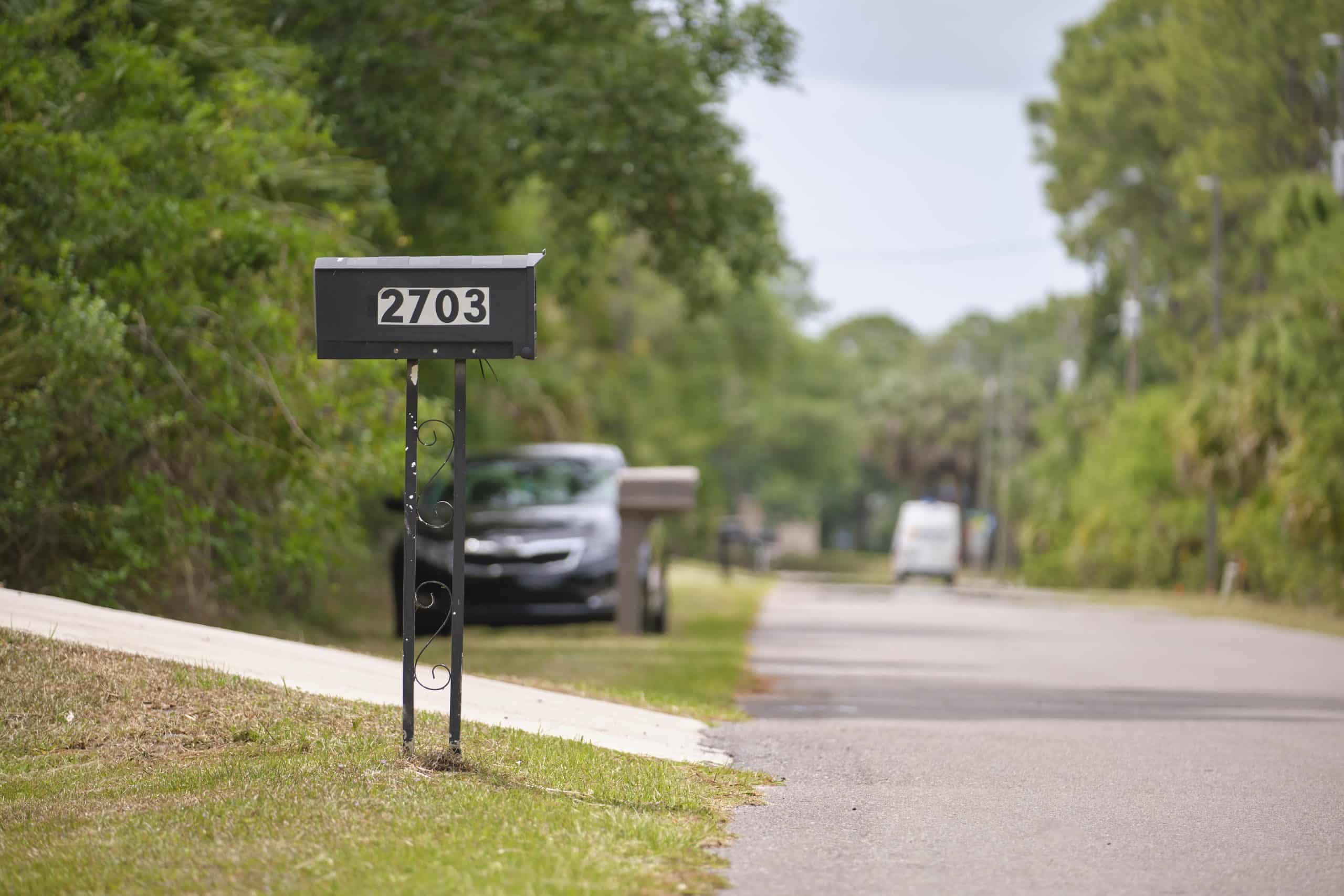 Typical american outdoors mail box on suburban street side.